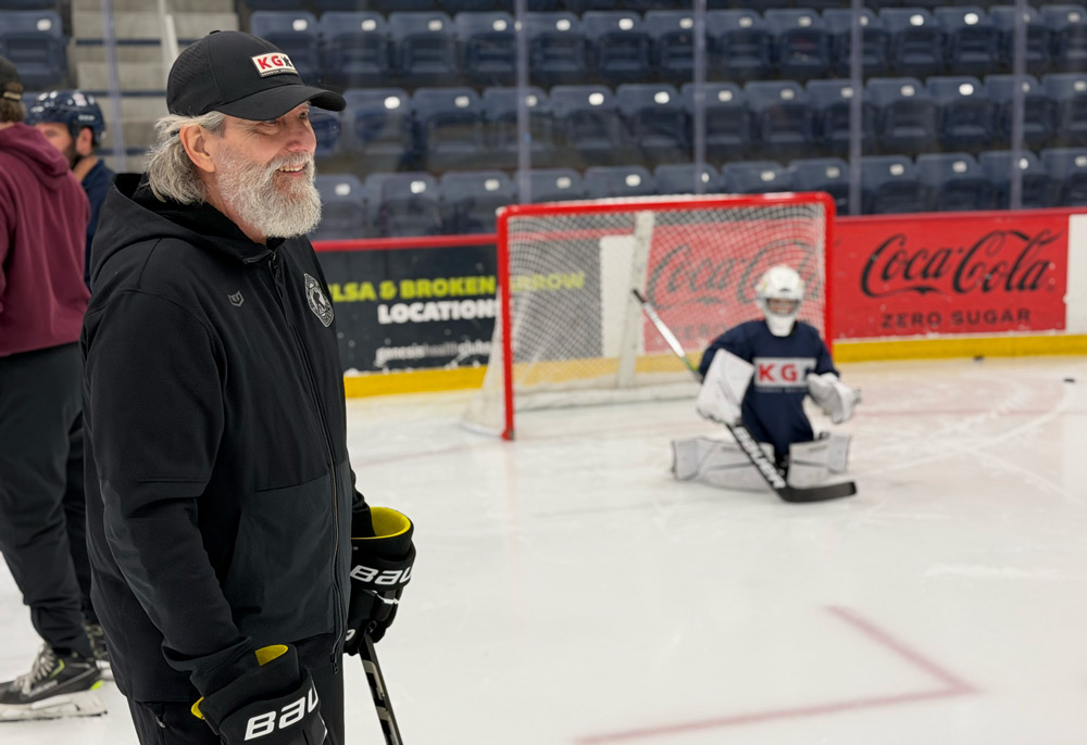 Jim Keserich smiling while watching a goalie in the butterfly